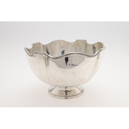 229 - AN EDWARDIAN SMALL SILVER ROSE BOWL. shaped circular outline, with a reeded rim and inscribed to one... 