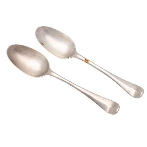 23 - A PAIR OF GEORGE I HANOVERIAN PATTERN SILVER TABLE SPOONS. with a moulded rattail, crested on the ba... 