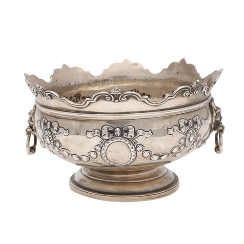 231 - AN EDWARDIAN SILVER ROSE BOWL. shaped circular outline, with a moulded border, twin lion mask ring h... 