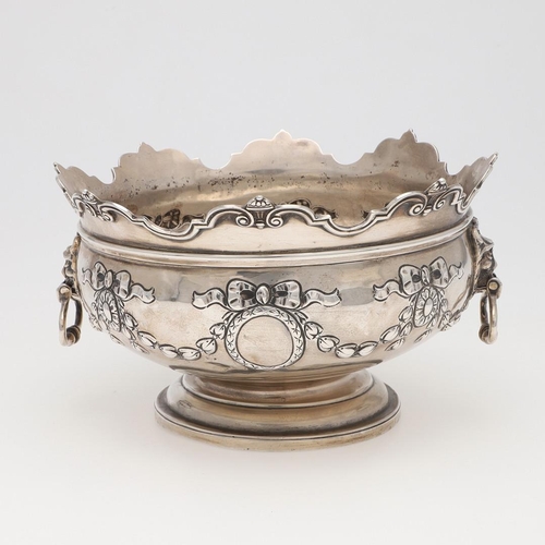 231 - AN EDWARDIAN SILVER ROSE BOWL. shaped circular outline, with a moulded border, twin lion mask ring h... 