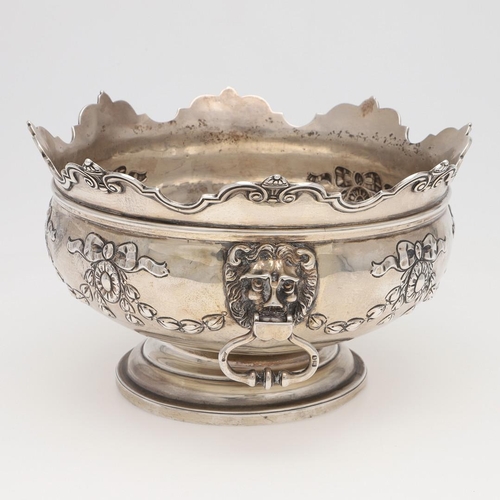 231 - AN EDWARDIAN SILVER ROSE BOWL. shaped circular outline, with a moulded border, twin lion mask ring h... 