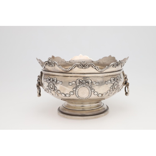 231 - AN EDWARDIAN SILVER ROSE BOWL. shaped circular outline, with a moulded border, twin lion mask ring h... 