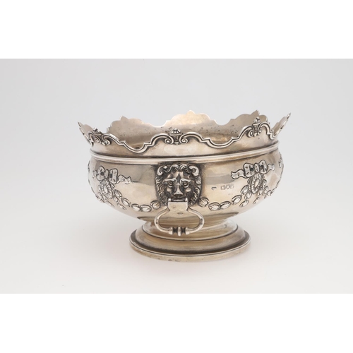 231 - AN EDWARDIAN SILVER ROSE BOWL. shaped circular outline, with a moulded border, twin lion mask ring h... 