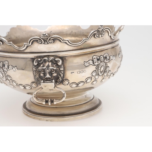 231 - AN EDWARDIAN SILVER ROSE BOWL. shaped circular outline, with a moulded border, twin lion mask ring h... 