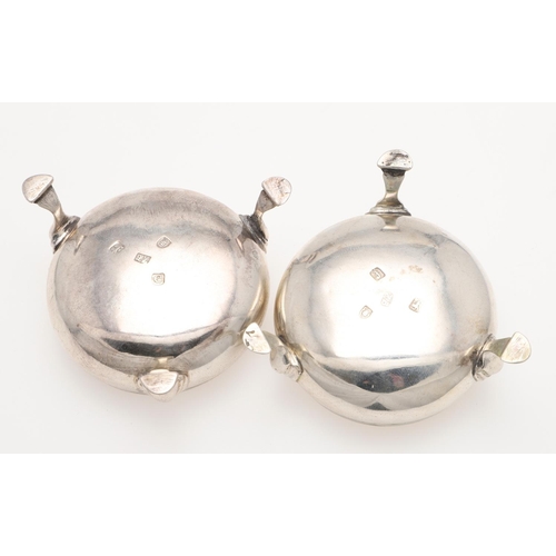 232 - A PAIR OF GEORGE III SQUAT CIRCULAR SILVER SALTS, BY HESTER BATEMAN. with corded borders and hoof fe... 