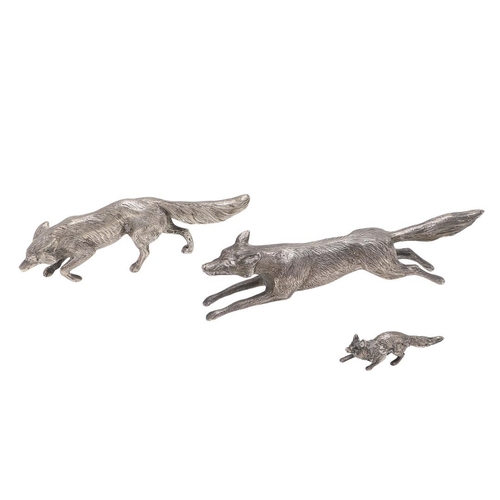 235 - A MODERN SILVER FIGURE OF A RUNNING FOX. makers mark partially lost in decoration, London 1963, toge... 