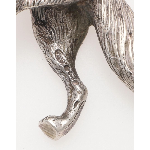 235 - A MODERN SILVER FIGURE OF A RUNNING FOX. makers mark partially lost in decoration, London 1963, toge... 