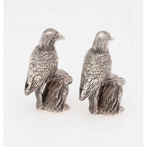 239 - A PAIR OF MODERN SILVER FIGURES OF WOODPECKERS. perched on tree stumps, by Paul Eaton, London 1990; ... 