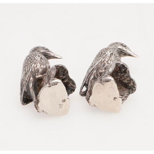 239 - A PAIR OF MODERN SILVER FIGURES OF WOODPECKERS. perched on tree stumps, by Paul Eaton, London 1990; ... 