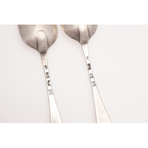 25 - A PAIR OF GEORGE III HANOVERIAN PATTERN SILVER TABLE SPOONS. crested on the back of their terminals,... 