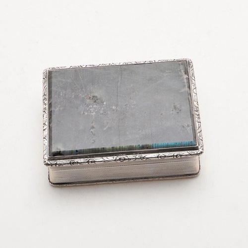 253 - A GEORGE VI RECTANGULAR SILVER SNUFF BOX. with floral scroll borders, the hinged cover inset with a ... 