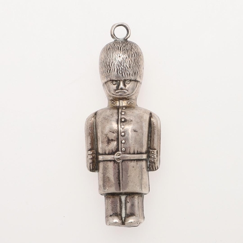 258 - A 20TH CENTURY SILVER CHILD'S RATTLE. in the form of a guardsman and with a suspensory ring, by W.H ... 