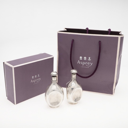 270 - A PAIR OF MODERN SILVER SCENT BOTTLES, BY ASPREY. in the form of Haig's Dimple whiskey bottles, Lond... 