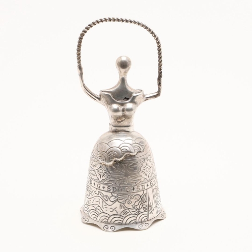 273 - A SILVER BELL. in the form of a lady wearing a crinoline dress with a rope in her hands, the chased ... 