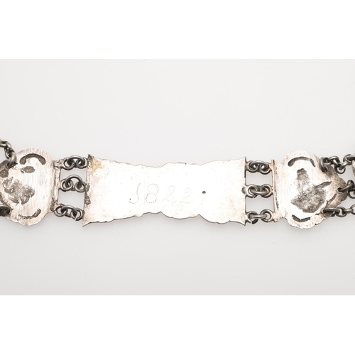 296 - A DUTCH SILVER BELT. with alternating panels decorated in relief with figures within scroll borders,... 