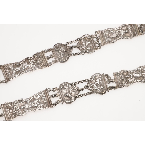 296 - A DUTCH SILVER BELT. with alternating panels decorated in relief with figures within scroll borders,... 