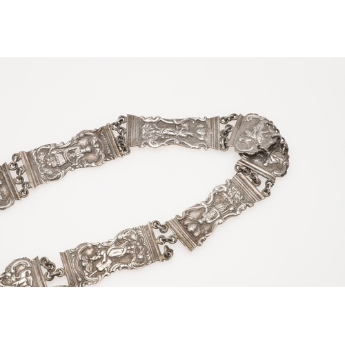 296 - A DUTCH SILVER BELT. with alternating panels decorated in relief with figures within scroll borders,... 