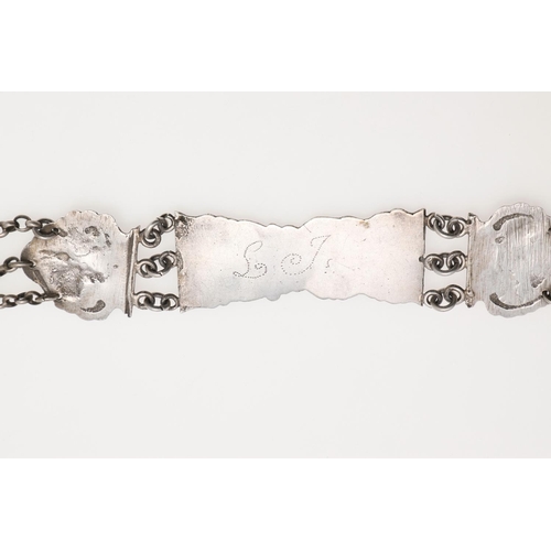 296 - A DUTCH SILVER BELT. with alternating panels decorated in relief with figures within scroll borders,... 