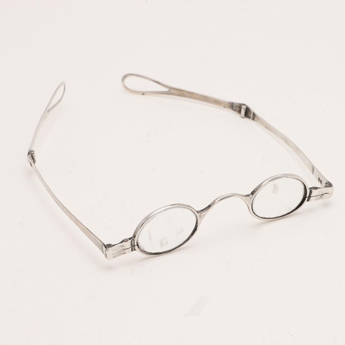 301 - A VICTORIAN PAIR OF FOLDING SILVER SPECTACLES. with double-hinged arms, no makers mark, London 1841;... 