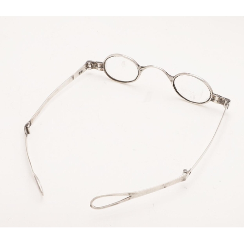 301 - A VICTORIAN PAIR OF FOLDING SILVER SPECTACLES. with double-hinged arms, no makers mark, London 1841;... 