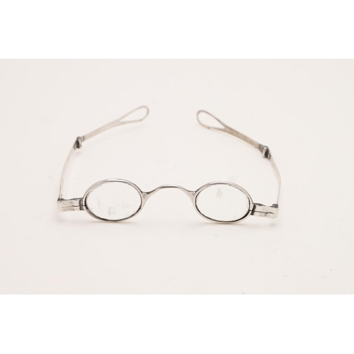 301 - A VICTORIAN PAIR OF FOLDING SILVER SPECTACLES. with double-hinged arms, no makers mark, London 1841;... 