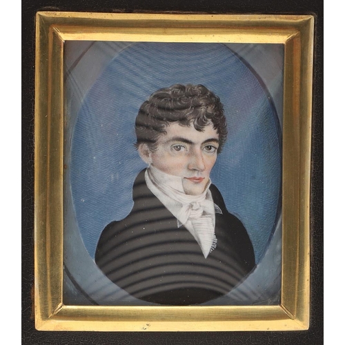 307 - ENGLISH SCHOOL. Miniature portrait of a young man wearing blue jacket and white stock on ivory, 5.5 ... 