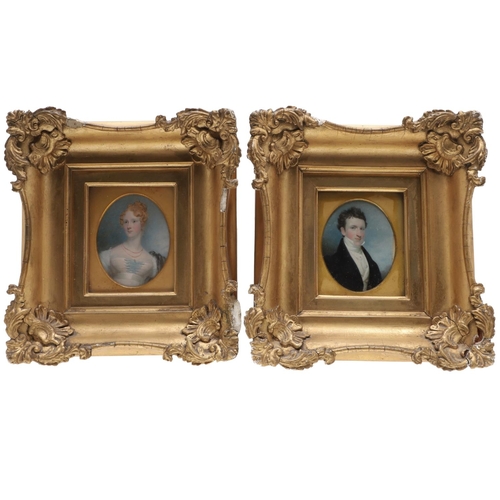 311 - A PAIR OF MINIATURE PORTRAITS. pair of miniature portraits, of a lady with fair hair wearing blue la... 