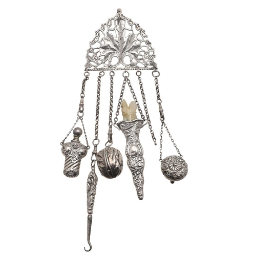 315 - A CONTINENTAL SILVER CHATELAINE CLIP. with pierced decoration, a serpent clip, six suspended chains ... 