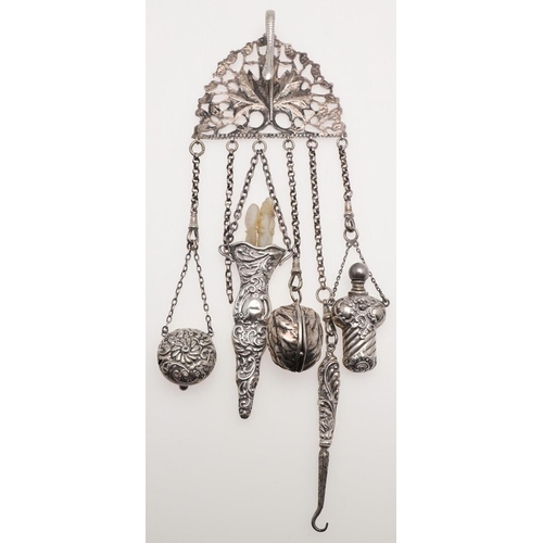 315 - A CONTINENTAL SILVER CHATELAINE CLIP. with pierced decoration, a serpent clip, six suspended chains ... 