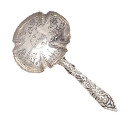 42 - A WILLIAM IV SILVER CADDY SPOON. with an embossed stem & terminal, initialled on the reverse &  the ... 