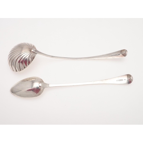 47 - A GEORGE III OLD ENGLISH PATTERN SILVER SOUP LADLE. with a fluted bowl, by George Smith & William Fe... 