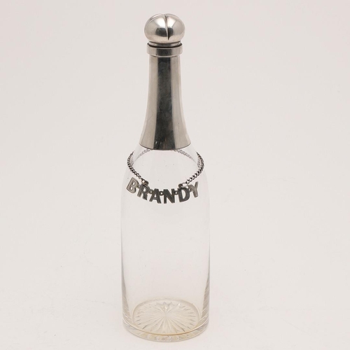 80 - A LATE VICTORIAN SILVER MOUNTED CLEAR GLASS BOTTLE. with a star-cut base and a hinged cover, togethe... 