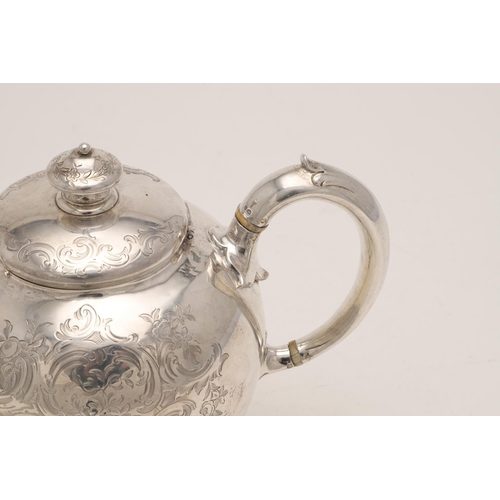 87 - A VICTORIAN SMALL BULLET-SHAPED SILVER TEA POT. with a knop finial and engraved decoration, crested,... 