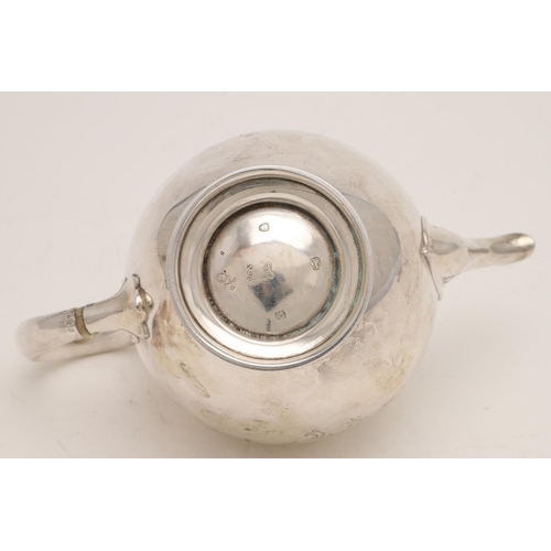 87 - A VICTORIAN SMALL BULLET-SHAPED SILVER TEA POT. with a knop finial and engraved decoration, crested,... 