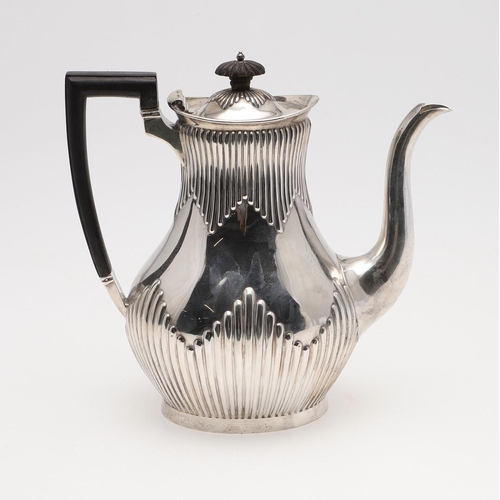 89 - A LATE VICTORIAN SILVER COFFEE POT. with a part-fluted baluster body and an angular handle, by Mappi... 