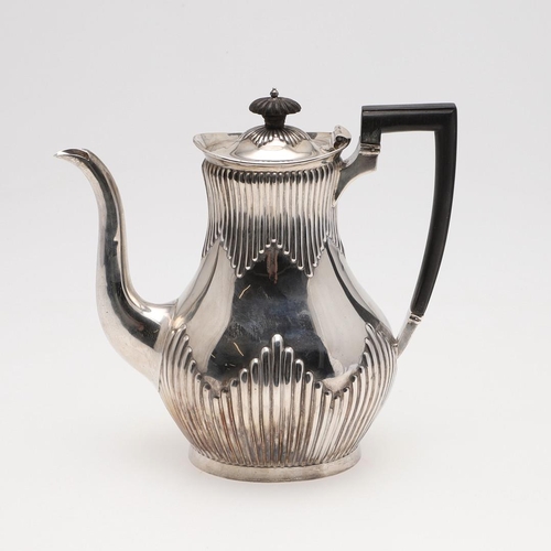 89 - A LATE VICTORIAN SILVER COFFEE POT. with a part-fluted baluster body and an angular handle, by Mappi... 