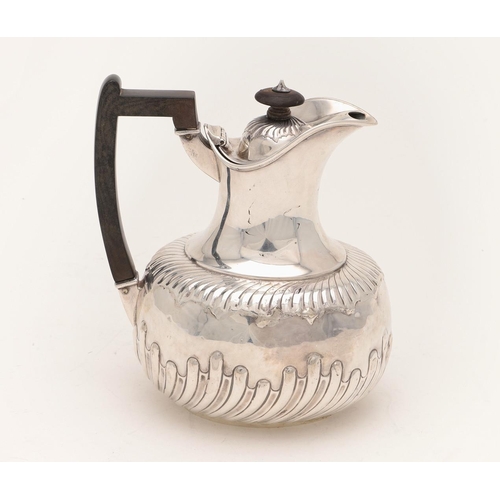 94 - A VICTORIAN SILVER HOT WATER JUG. oval outline, with a bellied body and part-fluted decoration, by M... 