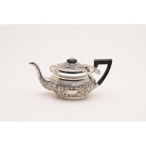 96 - A LATE VICTORIAN EMBOSSED SILVER TEA POT. rounded oblong, with a gadrooned border and inscribed 