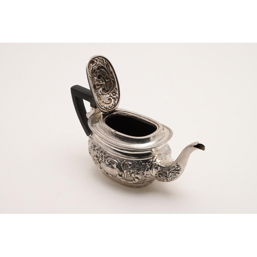 96 - A LATE VICTORIAN EMBOSSED SILVER TEA POT. rounded oblong, with a gadrooned border and inscribed 