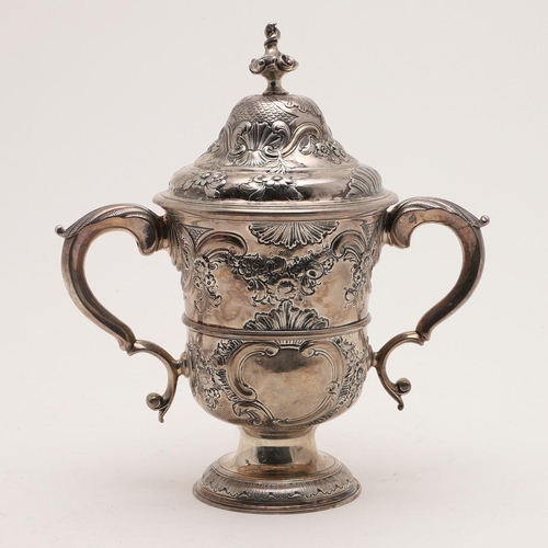 99 - A GEORGE III NORTH-COUNTRY PROVINCIAL TWO-HANDLED SILVER CUP. of campana form, with later embossing ... 