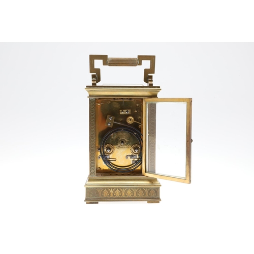 1139 - A LATE 19TH CENTURY BRASS CARRIAGE CLOCK. with enamel dial to an engine turned brass surround, the m... 