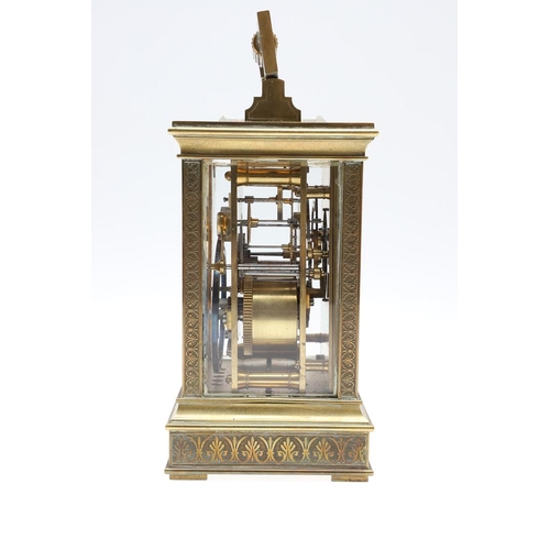 1139 - A LATE 19TH CENTURY BRASS CARRIAGE CLOCK. with enamel dial to an engine turned brass surround, the m... 