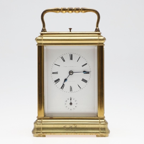 1140 - A LARGE MID 19TH CENTURY BRASS REPEATING CARRIAGE CLOCK. the Roman numeral dial with subsidiary alar... 