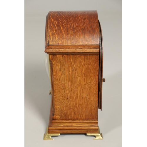 1142 - AN OAK CASED WINTERHALDER & HOFMEIER BRACKET CLOCK. early 20th century, the 7 3/4