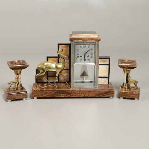 1148 - AN ART DECO MARBLE AND ONYX CLOCK GARNITURE. of architectural form, the two train clock striking the... 