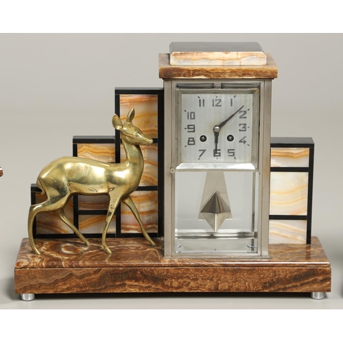 1148 - AN ART DECO MARBLE AND ONYX CLOCK GARNITURE. of architectural form, the two train clock striking the... 