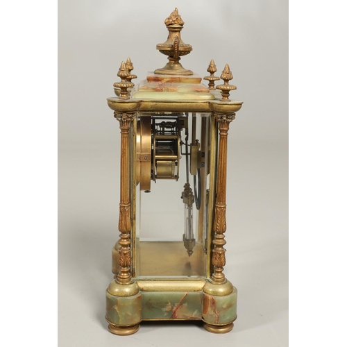 1157 - A FRENCH ONYX FOUR GLASS MANTEL CLOCK. late 19th century, the painted dial with ornate brass chasing... 