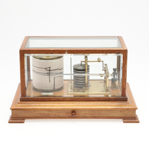 1164 - AN OAK CASED 'STORMOGRAPH' BAROGRAPH. by Short & Mason of London, in an oak case with cylindrical dr... 