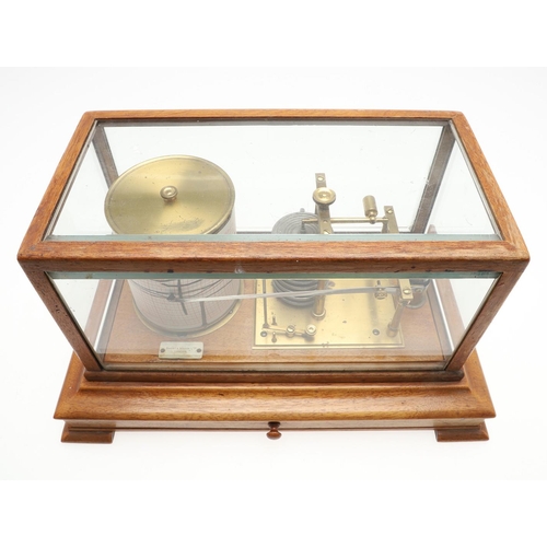 1164 - AN OAK CASED 'STORMOGRAPH' BAROGRAPH. by Short & Mason of London, in an oak case with cylindrical dr... 