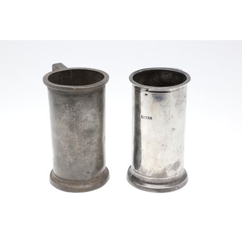 1174 - TWO MID-LATE 19TH CENTURY FRENCH PEWTER LIDDED MEASURES. of double and single litre size, the talles... 